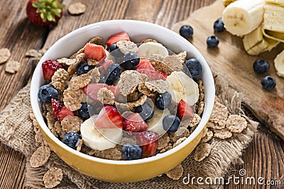 Portion of Cornflakes with fresh Fruits Stock Photo