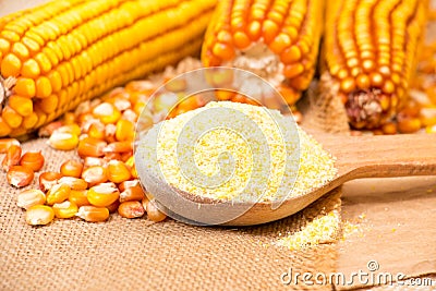 Portion of Cornmeal on rustic background Stock Photo