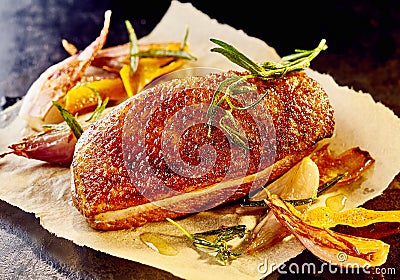 Portion of duck breast and bacon on paper Stock Photo