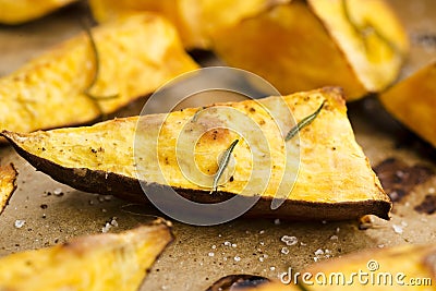 Portion of fresh baked sweet potato wedges Stock Photo