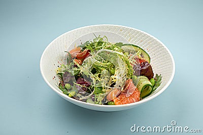 Portion of fresh gourmet salad with salmon Stock Photo