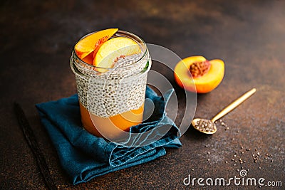 Portion healthy vegan chia pudding with almond milk, vanilla and peache Stock Photo