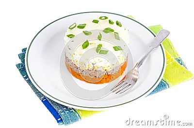 Portion layered salad with fish, carrots and eggs. Stock Photo
