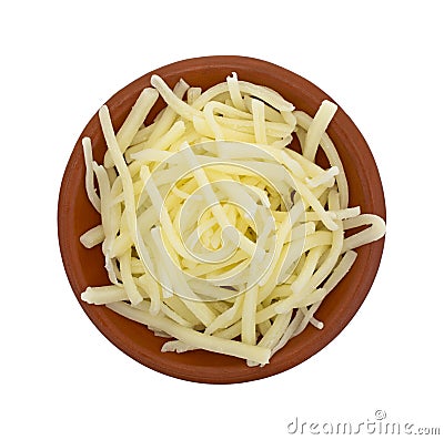 Portion of natural white mild cheddar cheese in bowl Stock Photo