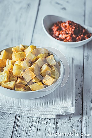 Portion of patatas bravas with sauces Stock Photo