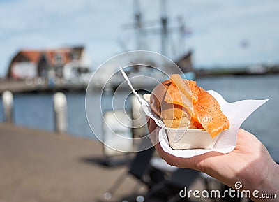 Portion of salmon sandwich sold in The Netherlands as a street snack food and called broodje zalm in dutch Stock Photo