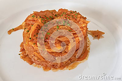 Portion of stewed cabbage on a plate, closeup Stock Photo