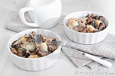 Portions of baked tuna with mushrooms Stock Photo