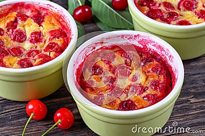 Portions of Cherry clafouti in ceramic ramekins Stock Photo