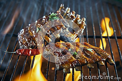 Portions of spicy pork ribs on a BBQ grill Stock Photo