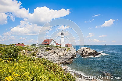 Portland Head Lighthouse in Maine, blooming flowers in front of lighthouse, USA Stock Photo