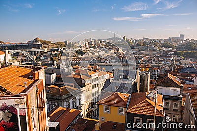 Porto panoramic landmark with boats river Douro. Old buildings with brick roofs by river Douro in Porto, Portugal. Stock Photo