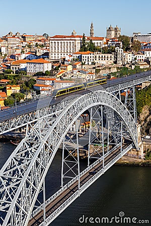 Porto Portugal with bridge Ponte Dom Luis I Douro river with tram town travel portrait format Editorial Stock Photo