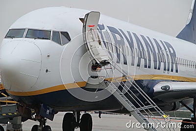 Passengers getting off the plane of Ryanair company at the Porto airport Editorial Stock Photo