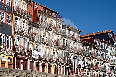 Typical scene in urban Porto, with laundry hanging out to dry on the balcony in downtown area Editorial Stock Photo