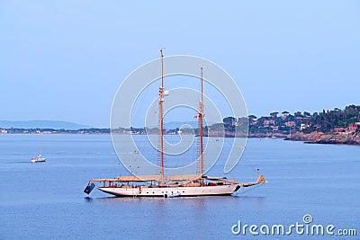 Porto Santo Stefano, Italy - August 2020: Beautiful huge sail boat with two masts anchored in the bay Editorial Stock Photo