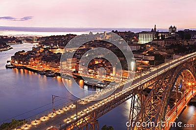 Porto skyline and Douro River at dusk with Dom Luis I Bridge on the foreground Stock Photo