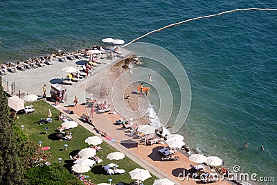 Tourists enjoy the beach in Portoroz, Slovenia Editorial Stock Photo