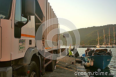 Portovenere at dawn: garbage collection on the marina pier Editorial Stock Photo