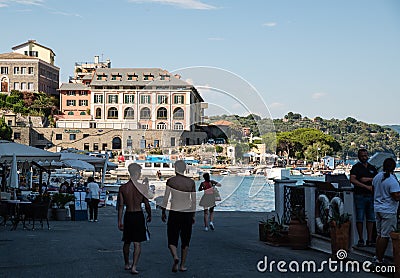 Portovenere, Liguria, Italy. June 2020. View of the promenade in front of the beautiful houses with colorful facades: people Editorial Stock Photo