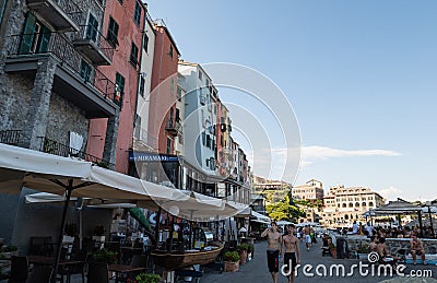 Portovenere, Liguria, Italy. June 2020. View of the promenade in front of the beautiful houses with colorful facades: people Editorial Stock Photo