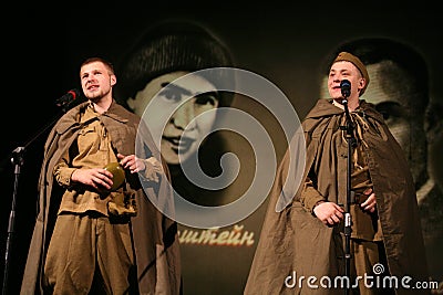 Portra Soviet soldiers, hero in uniform of World War II playing the accordion over black background. Editorial Stock Photo