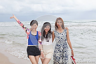 portrai of asian woman friend group relaxing cacation on sea beach with smiling and happiness face Stock Photo