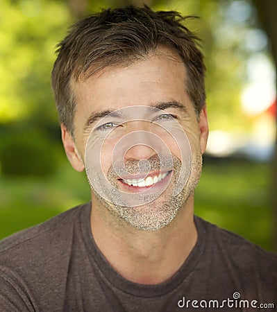Portrait Of A Active Man Smiling At The Camera Stock Photo