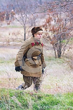 Portrait of actress dressed as Russian Soviet soldier of World War II in military-historical reconstruction in Volgograd. Editorial Stock Photo