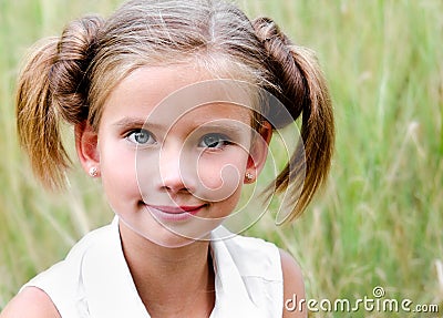 Portrait of adorable smiling little girl child in dress Stock Photo