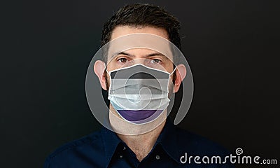 Man wearing a LGBT asexual flag colors protective face mask Stock Photo