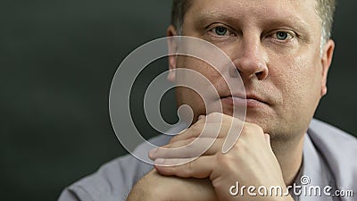 Portrait of an adult tired blond teacher in a blue Stock Photo