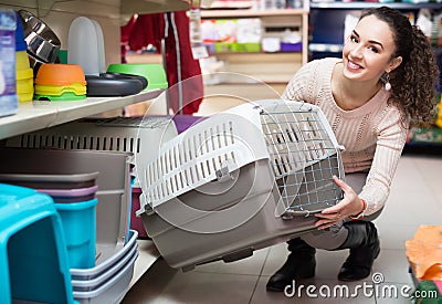 Portrait of adult woman purchasing pet kennels Stock Photo