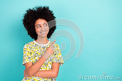 Portrait of advertiser young age chevelure hair kid girl directing finger mockup recommend newspaper isolated on cyan Stock Photo