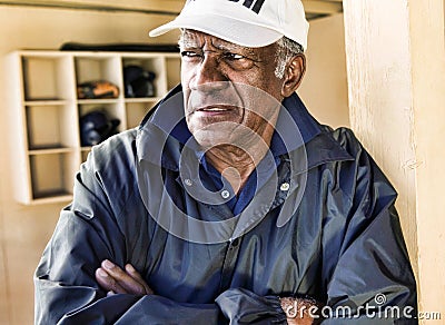Portrait of african american Baseball Coach Standing in Dugout Stock Photo