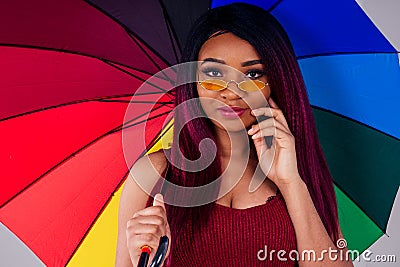 Portrait african american beautiful woman creative hair coloring dye purple color on white background in studio black Stock Photo