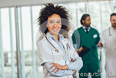 African american female doctor on hospital looking at camera smiling Stock Photo