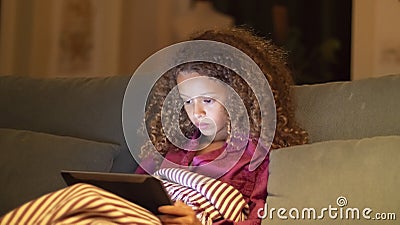Close-up of young girl watching digital tablet Stock Photo
