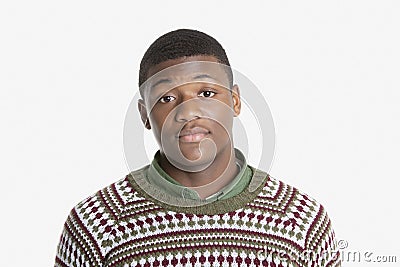 Portrait of an African American young man in sweater over gray background Stock Photo