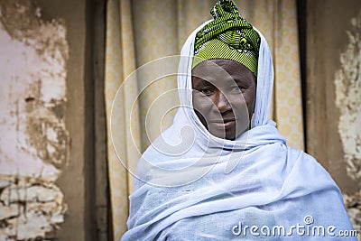 Portrait of an African woman wearing a hijab in a slum of the city of Bissau, in Guinea-Bissau Editorial Stock Photo