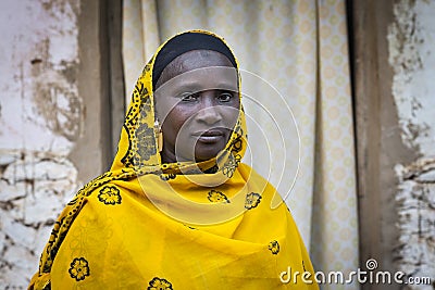 Portrait of an African woman wearing a hijab in a slum of the city of Bissau, in Guinea-Bissau Editorial Stock Photo