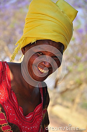 Portrait african women laughing with yellow turban Editorial Stock Photo