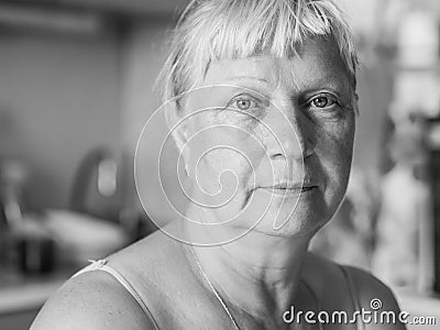 Aged woman at the kitchen. Stock Photo