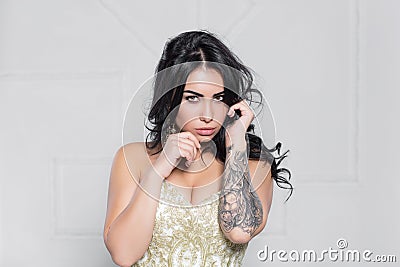 Portrait of a alluring brunette with a tattoo Stock Photo