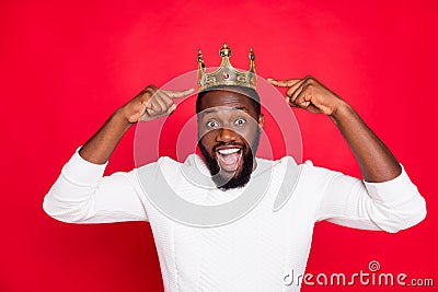 Portrait of amazed crazy afro american beard man point at his crown scream wow omg win prom party competition become Stock Photo