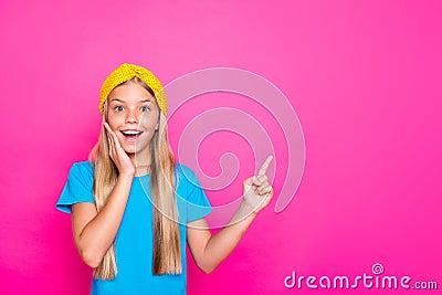 Portrait of amazed crazy funny funky child point index finger copy space impressed scream wow omg wear blue t-shirt Stock Photo