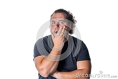 Portrait of amazed excited man doesn t believe his success, keeps hands on head, says omg or wow Stock Photo