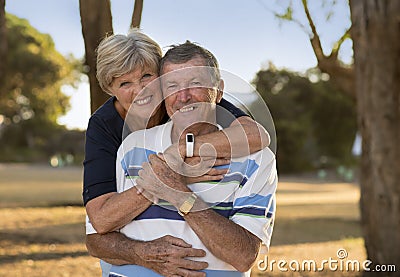 Portrait of American senior beautiful and happy mature couple around 70 years old showing love and affection smiling together in t Stock Photo