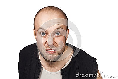 Portrait of angry bald man aggressive thug threatens. Concept portrait of a dangerous criminal on an isolated white background Stock Photo