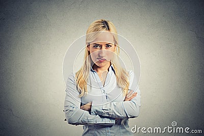 Portrait angry blonde woman on grey background Stock Photo